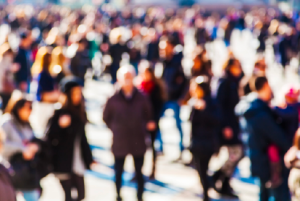 blurry image of an urban crowd